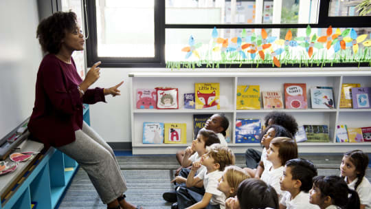 teacher holding morning meeting in classroom