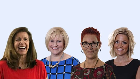 Coworkers smiling at office