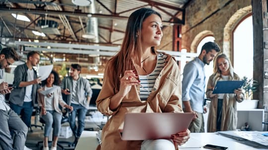 woman on laptop in modern office