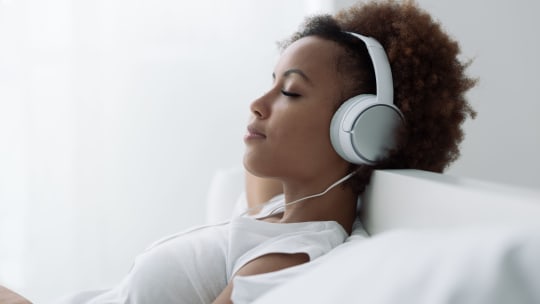 woman listening to headphones