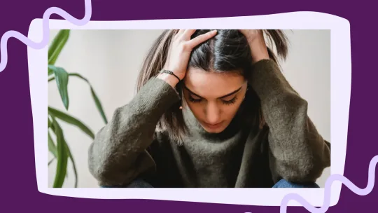 woman with her hands on her head looking stressed
