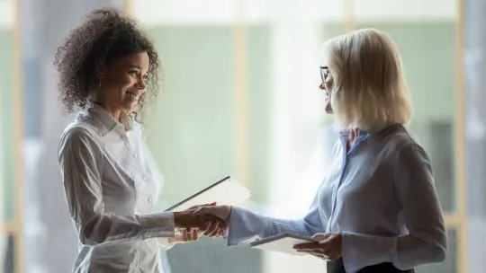 manager shaking employee's hand