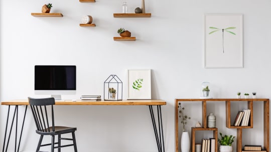 desk with shelves and art