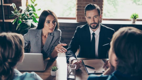 woman speaking up for herself in a meeting