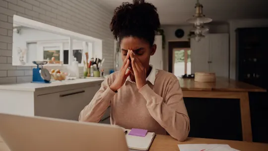 Sad woman at counter