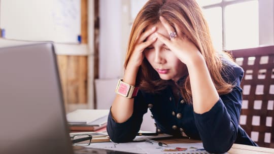 Woman Hungover at Work
