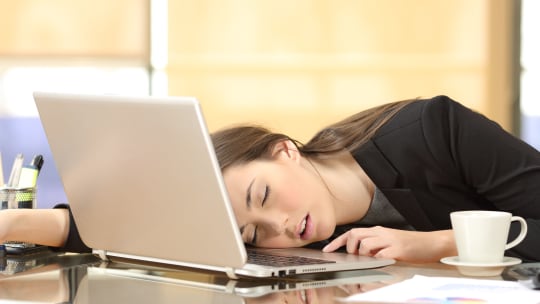 woman sleeping at work