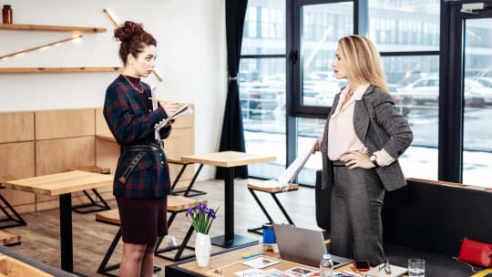 Two women talking at work
