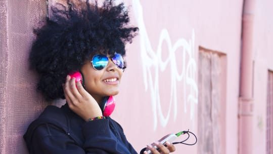 woman listening to music on headphones