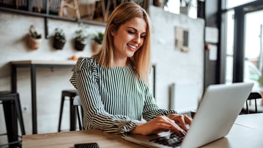 Woman typing on computer