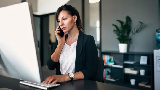 Serious woman on phone