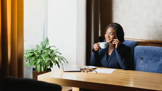 Woman smiling at desk