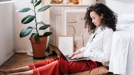 woman typing on laptop