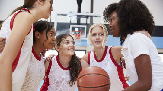 basketball coach huddle with high school players