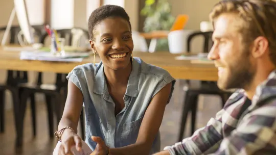 two people smiling