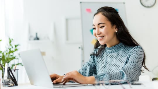Woman typing on computer