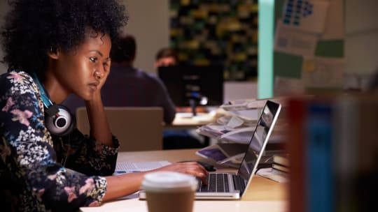 Woman working late