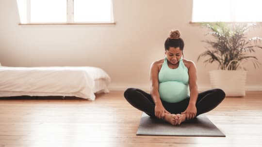 pregnant woman doing yoga