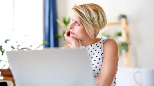 Woman upset on laptop