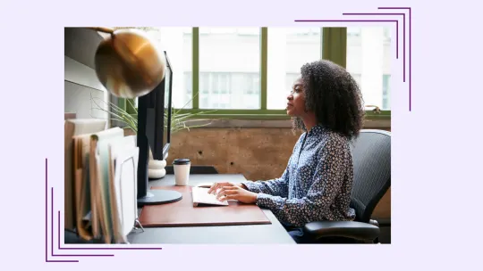 a woman working at a desk