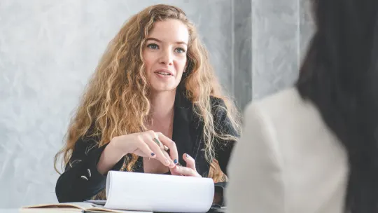 women talking at work