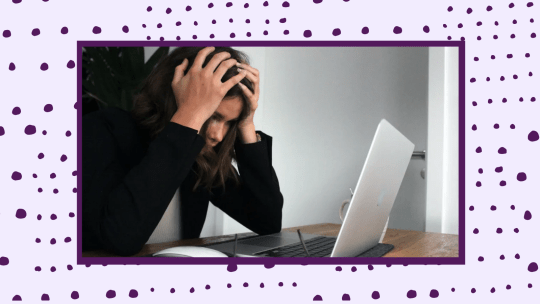 woman looking stressed staring at a laptop with her head in her hands