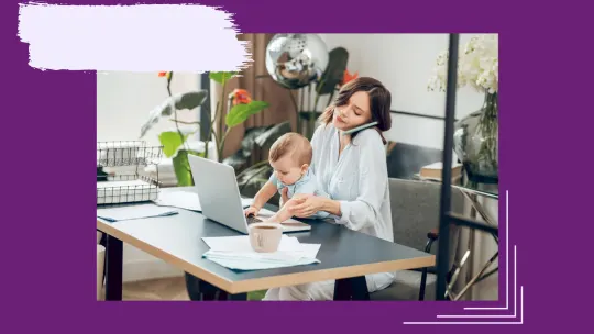 a mom working while holding a baby