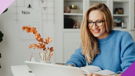 A woman looking for jobs in her laptop to illustrate importance of learning how to tell your boss you got a new job in the right time
