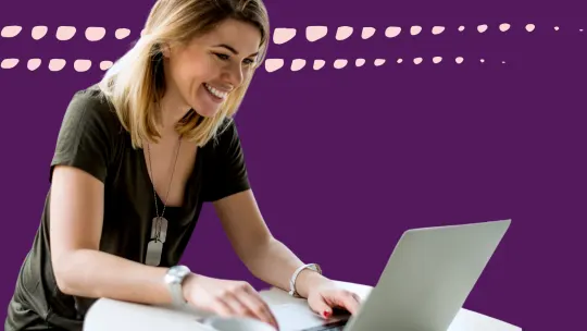 a woman typing on a computer