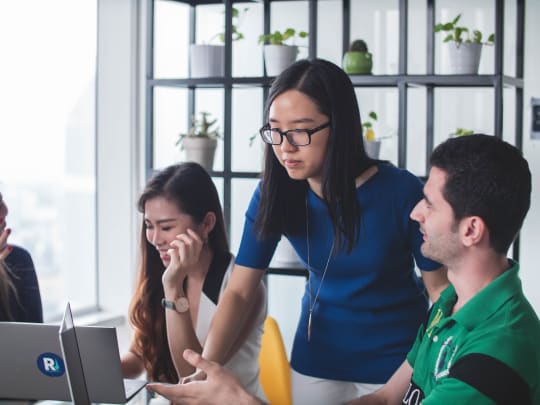 A woman leads a project at work. 