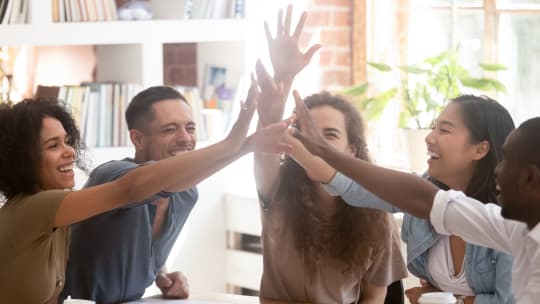 Employees high-fiving