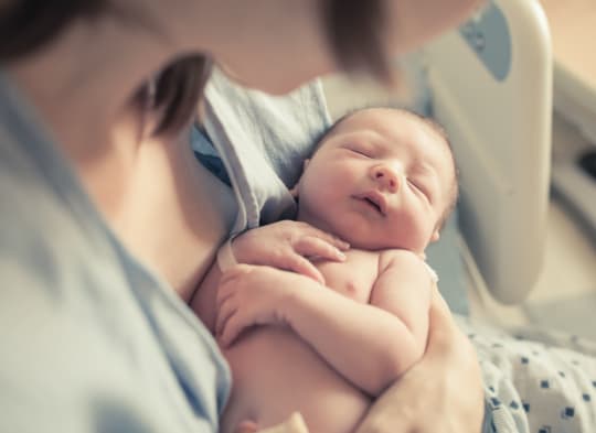 woman holding newborn