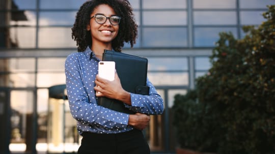 Woman standing outside building