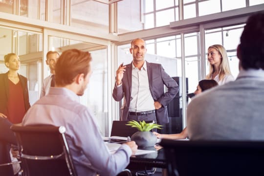 businessman presents in a meeting