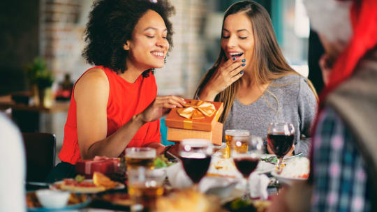 women exchanging gifts