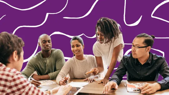 a group of people in a meeting