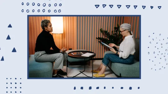 women sitting across from one another on facing couches