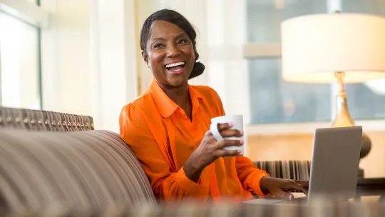 Happy woman on laptop