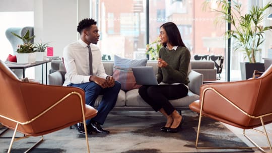 Workers conducting a performance review