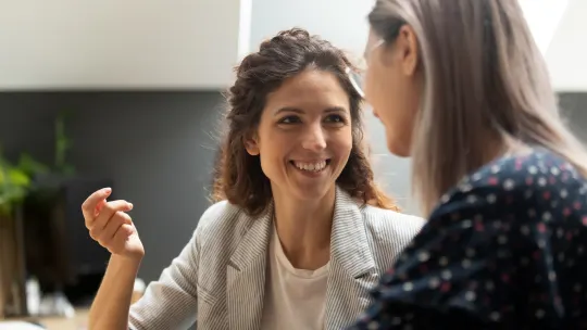 Two women talking