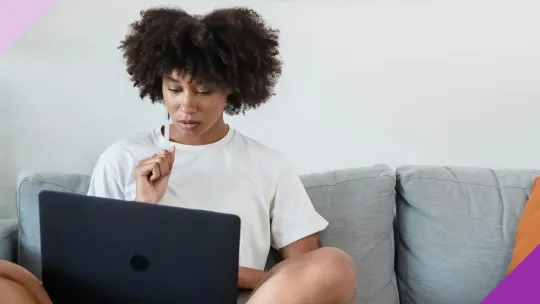 Professional at a computer, illustrating how to thrive financially as a freelancer