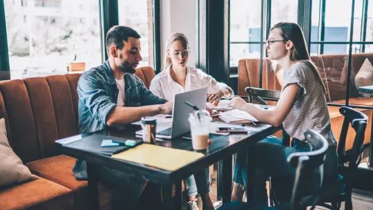 Colleagues talking at work