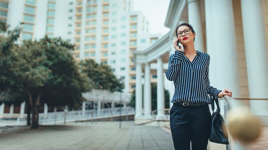 woman rushing to work with coffee in hand