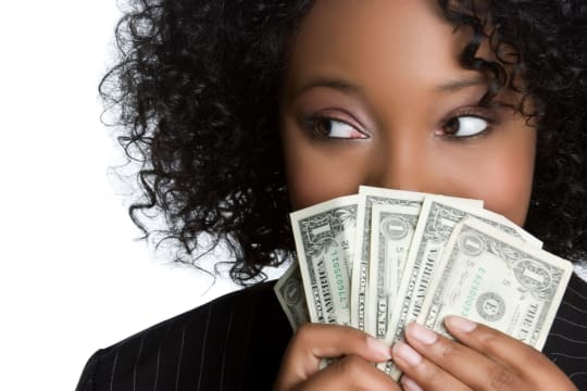 woman holding dollar bills