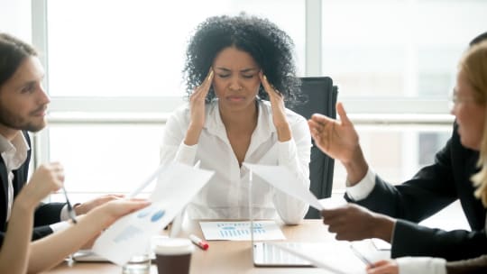 woman overwhelmed in a meeting