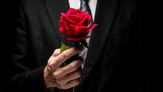 Bachelor contestant with rose