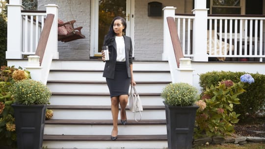 Woman leaving home for work