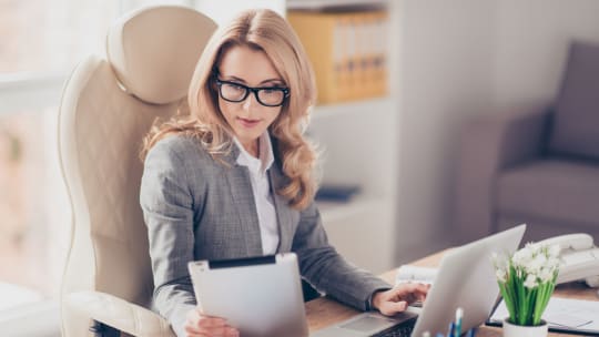 woman looking at a piece of paper