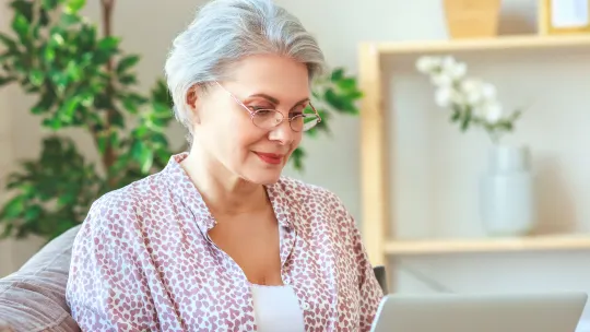 woman reading blog on laptop
