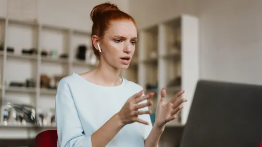 Woman typing on computer